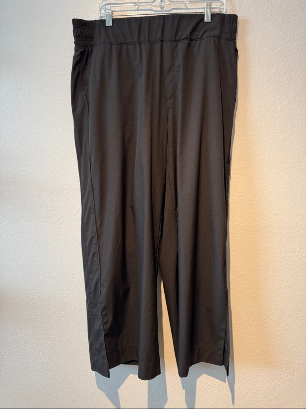 Woman’s gently worn Black Pull-On Casual Pants, slit hems with pockets